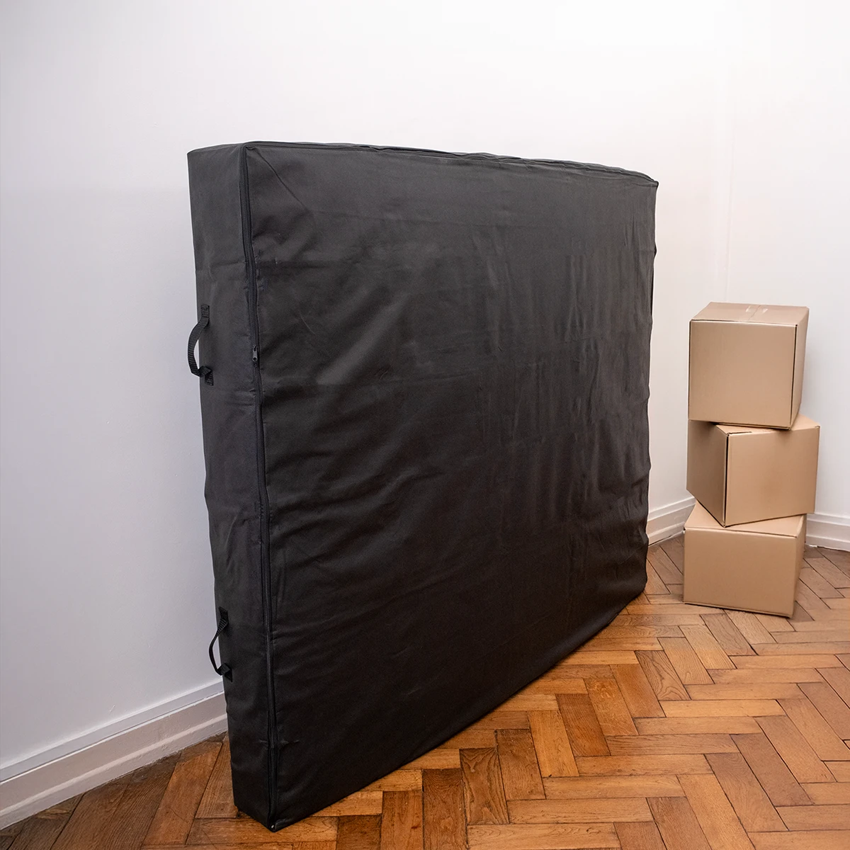 housse de transport et de stockage pour matelas utilisée lors d'un déménagement