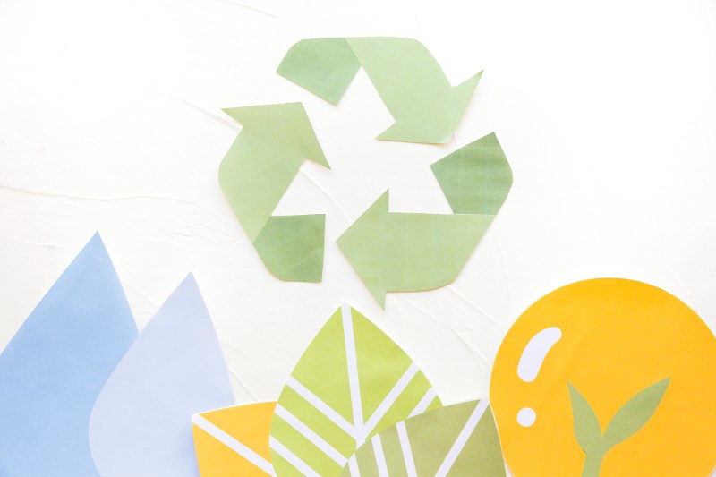 Eco-friendly bedding packaging concept with recycling symbols